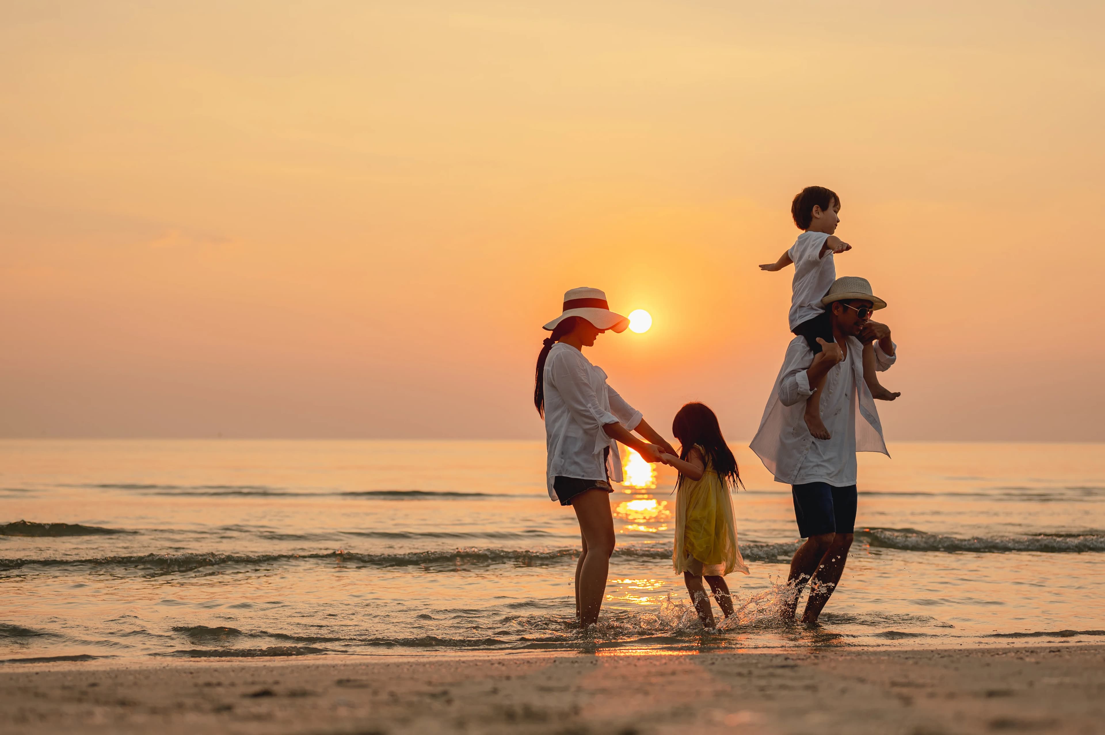 Family at sunset on the beach